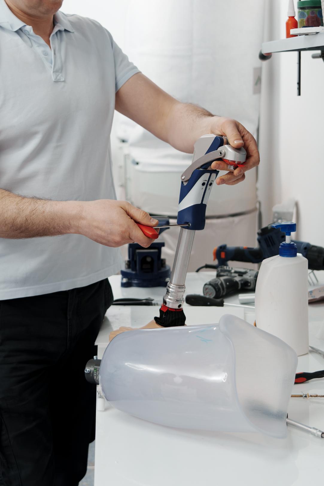 Plumber adjusting water heater valve